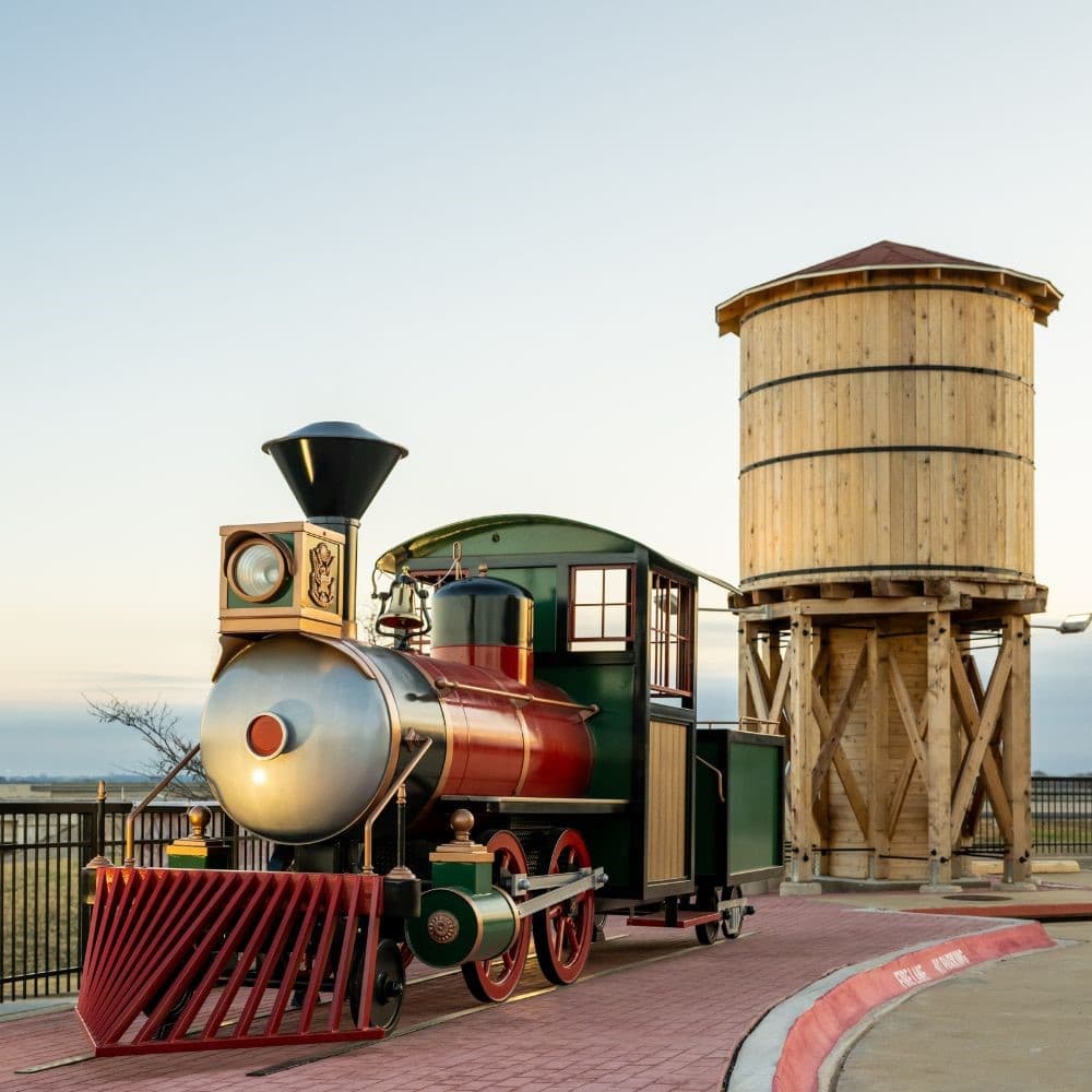 Outside image of Dental Depot's Arlington dentist office's model train and water tower.