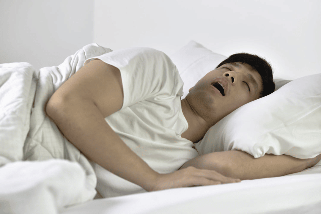 man sleeping on a pillow that has sleep apnea