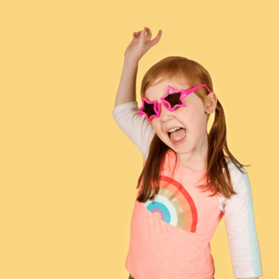 Little girl wearing pink star sunglasses